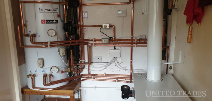 Bosky solid fuel cooker boiler linked with a Worcester oil fired open vent boiler via a Gledhill thermal store, installed by United Trades
